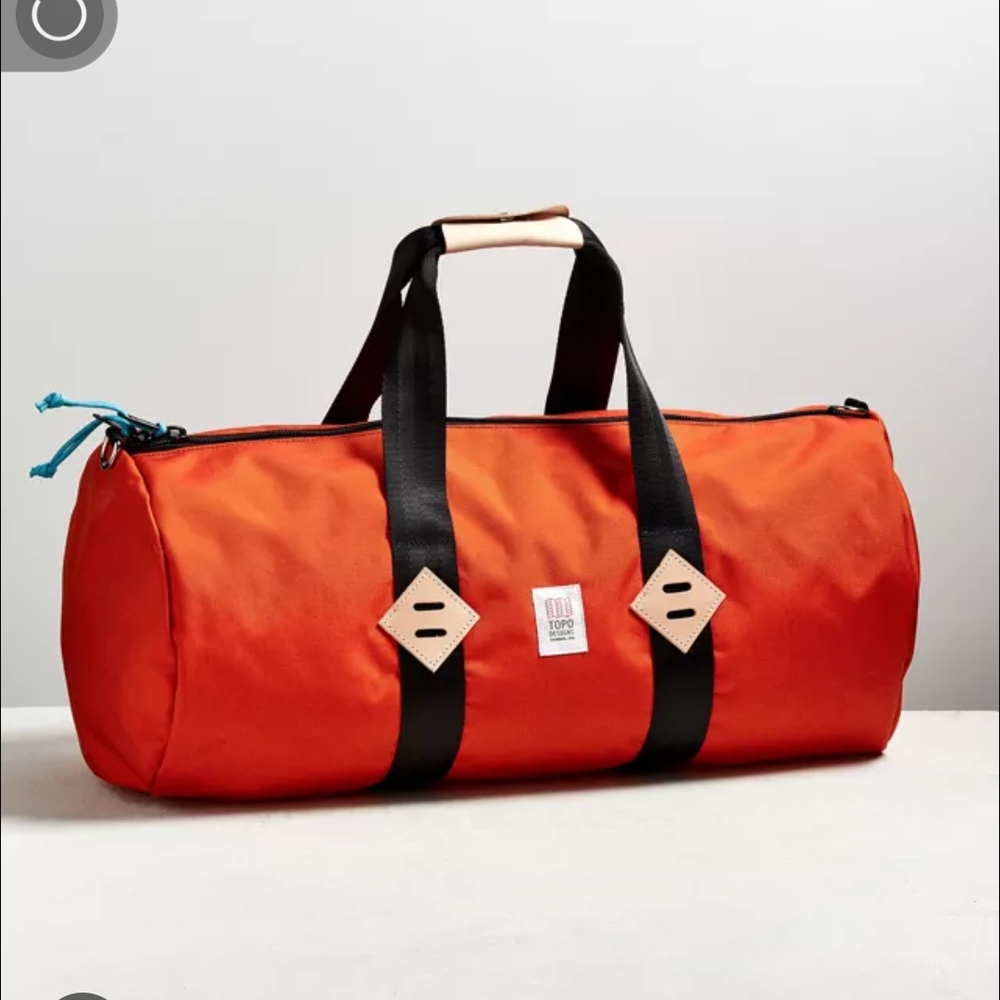 Topo Designs Bright Orange Duffel Bag with Black Straps